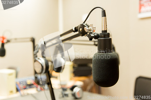 Image of microphone at recording studio or radio station