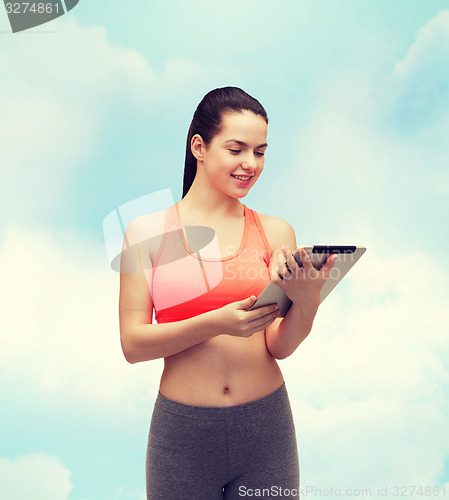 Image of sporty woman with tablet pc computer