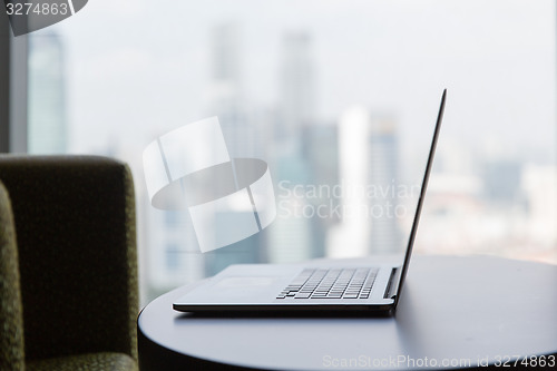 Image of close up of laptop computer on table at office