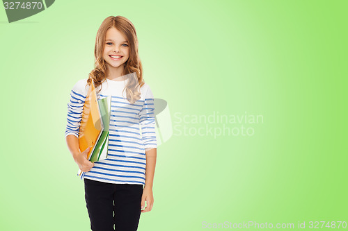 Image of happy girl holding colorful folders