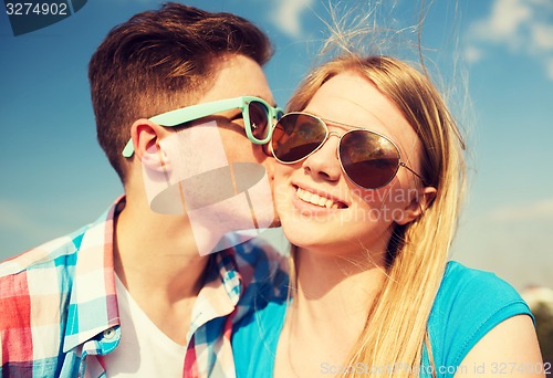 Image of smiling couple outdoors