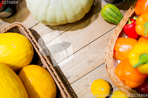 Image of vegetables in baskets on table at market or farm