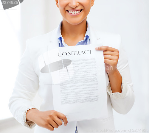 Image of african businesswoman holding contract