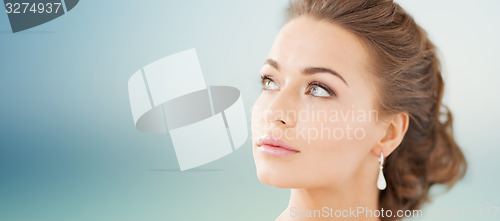 Image of woman with diamond earrings