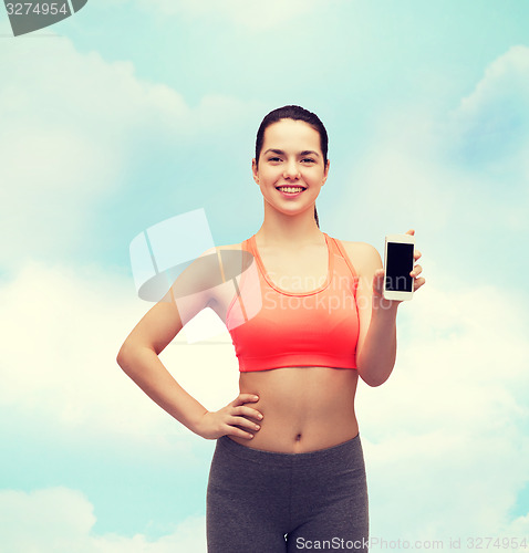 Image of sporty woman with smartphone