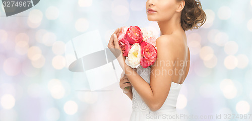 Image of bride or woman with bouquet of flowers