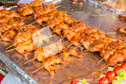 Image of chicken grill at street market