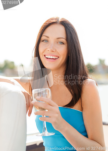 Image of laughing girl with champagne glass