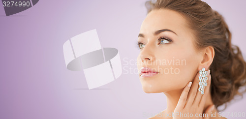 Image of woman with diamond earrings