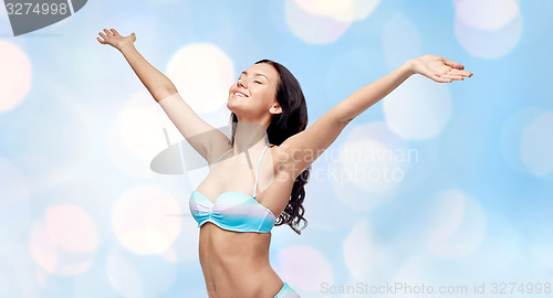 Image of happy woman in bikini swimsuit with raised hands
