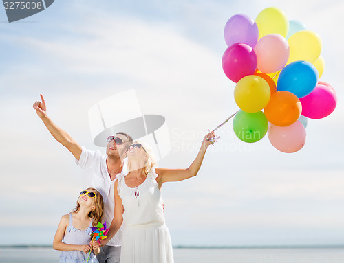 Image of family with colorful balloons