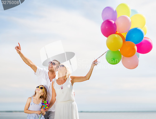 Image of family with colorful balloons