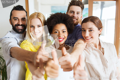 Image of happy creative team in office