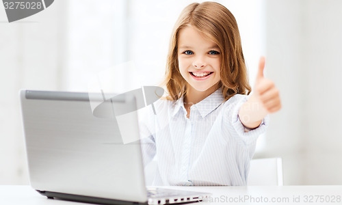 Image of girl with laptop pc at school