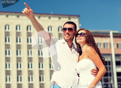 Image of smiling couple in city