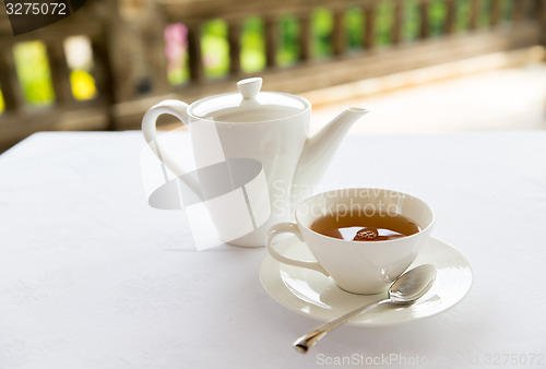 Image of tea-set on table at restaurant or teahouse