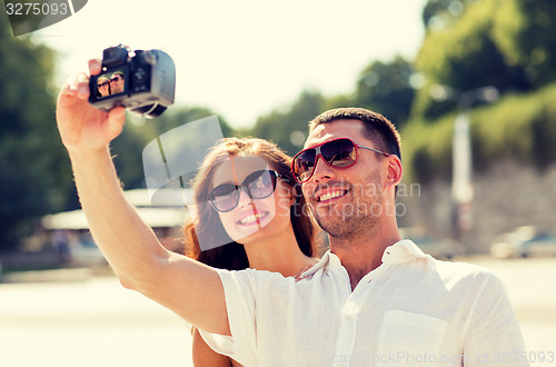 Image of smiling couple in city