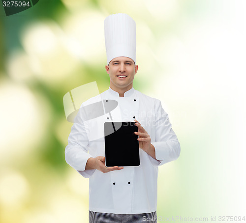 Image of happy male chef cook showing with tablet pc