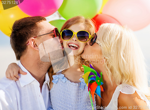 Image of family with colorful balloons