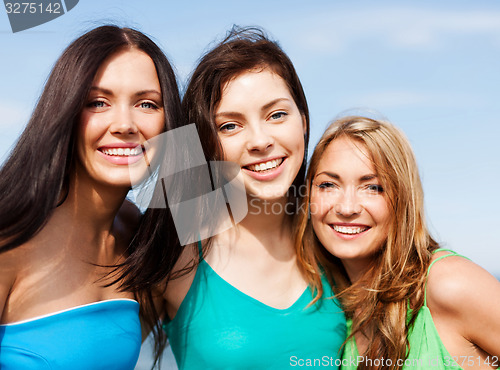 Image of girls walking on the beach