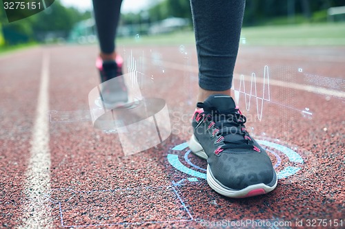 Image of close up of woman feet running on track