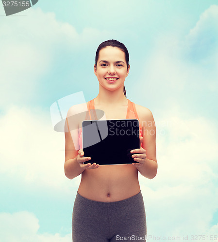 Image of sporty woman with tablet pc blank screen