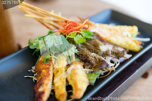 Image of close up of deep-fried asian snacks on plate