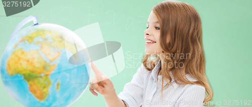 Image of smiling student girl with globe at school