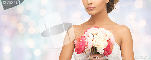 Image of bride or woman with bouquet of flowers