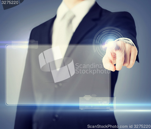 Image of male hand touching virtual screen