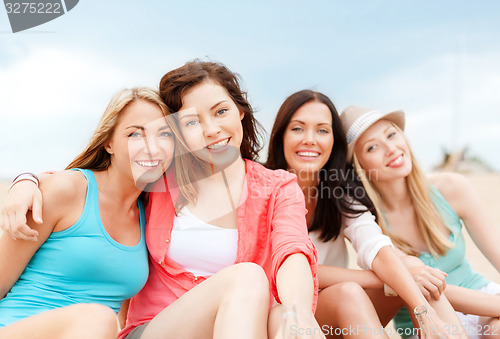 Image of girls with drinks on the beach