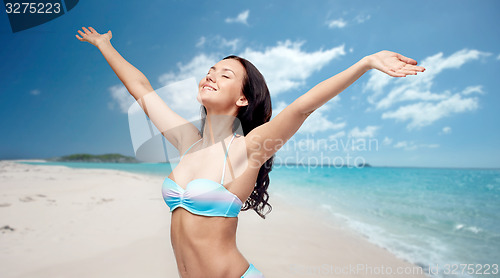 Image of happy woman in bikini swimsuit with raised hands