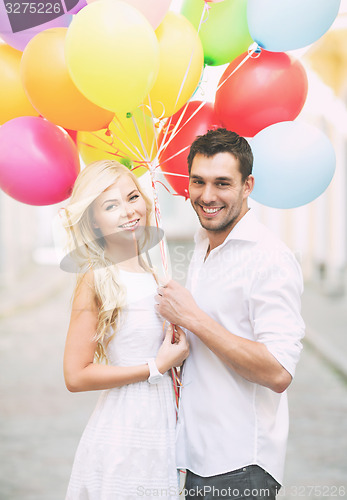 Image of couple with colorful balloons