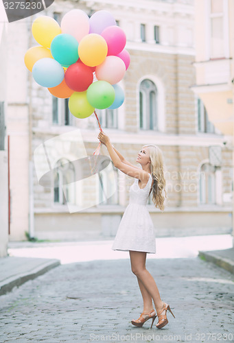 Image of woman with colorful balloons