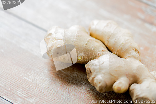 Image of close up of ginger root on wooden table