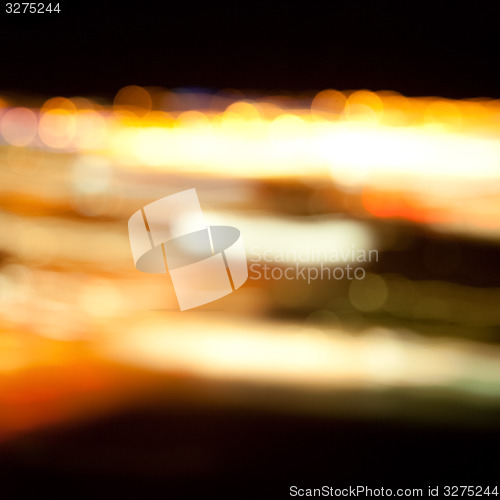 Image of golden bright lights on dark night background