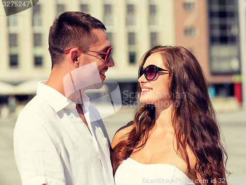 Image of smiling couple in city