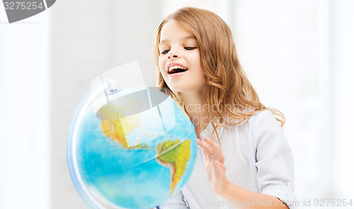 Image of student girl with globe at school