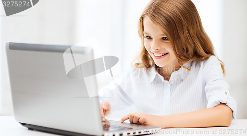 Image of girl with laptop pc at school