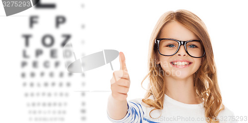 Image of little girl with black eyeglasses