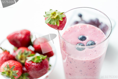 Image of close up of milkshake decorated with strawberry