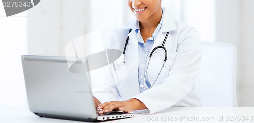 Image of female doctor with laptop pc