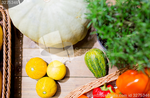 Image of vegetables in baskets on table at market or farm