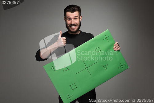 Image of The smiling man as businessman with green panel