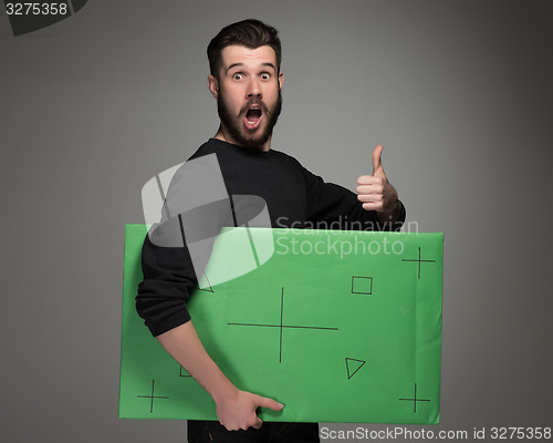 Image of The smiling man as businessman with green panel