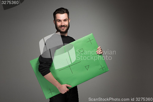Image of The smiling man as businessman with green panel