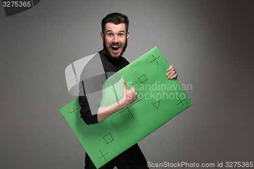 Image of The smiling man as businessman with green panel