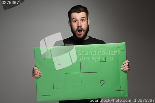 Image of The surprised man as businessman with green panel