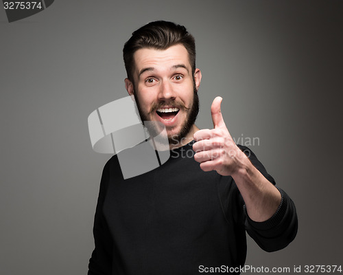 Image of portrait of handsome young smiling man