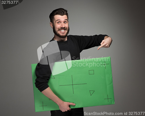 Image of The smiling man as businessman with green panel